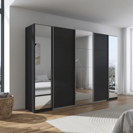 Black wardrobe with mirrors in a modern bedroom setting