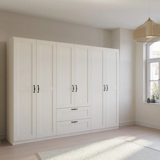 Rauch Cottage 271cm Wide 6 Door Wardrobe with Drawers - Styled in a Bedroom