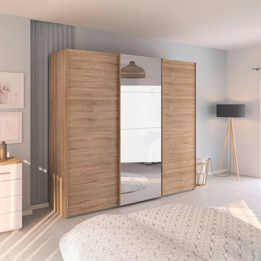 Rauch Wooden wardrobe with sliding doors in a modern bedroom setting