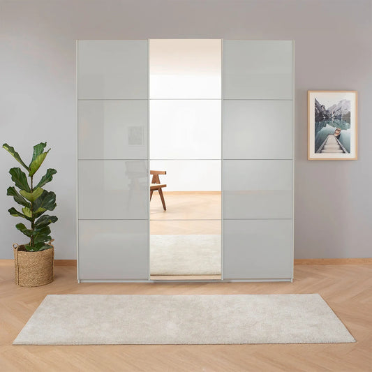 Rauch Forms Silk Grey Glass 3 Door Sliding Wardrobe with Mirror - Styled in a Living Area