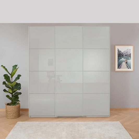 Rauch Forms Silk Grey Glass Triple Sliding Wardrobe - Styled in a Bedroom