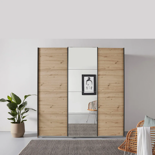 Rauch Forms Artisan Oak & Mirror 3 Door Sliding Wardrobe - Styled in a Bedroom