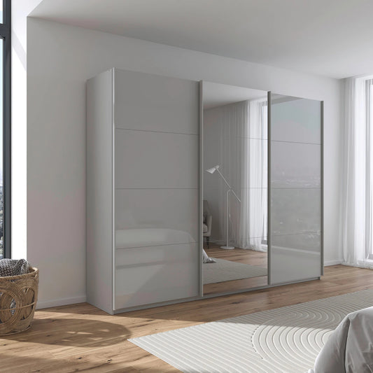 Rauch Forms three door sliding wardrobe with silk grey tempered glass fronts and a mirrored centre door