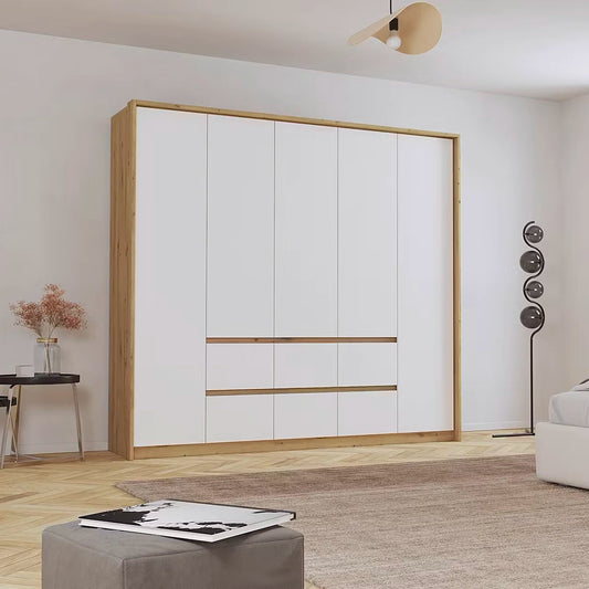 Large white wardrobe with wooden frame in a room with a rug and table.