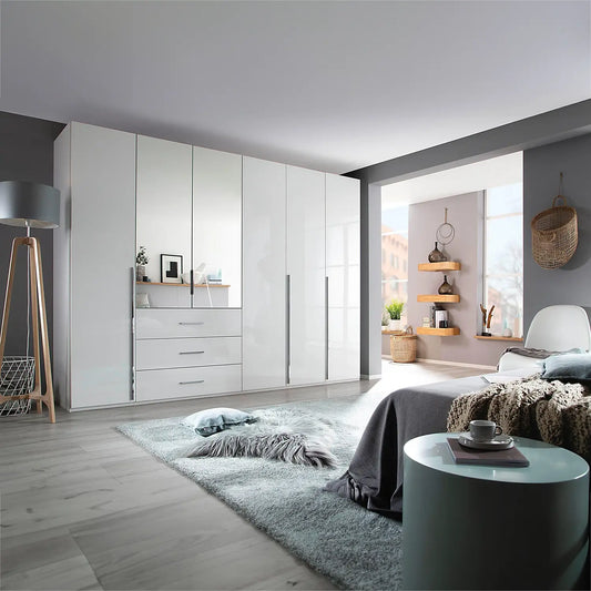 Rauch Montclar White High Gloss 6 Door Wardrobe with Drawers & Mirror - Styled in a Bedroom