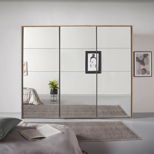Rauch Prism Artisan Oak 3 Door Full Mirror Sliding Wardrobe - 271cm - Styled in a Bedroom
