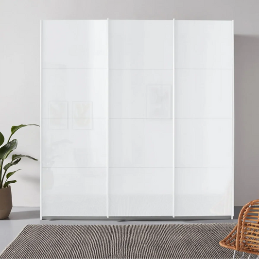 Rauch Forms 3 Door Sliding White Glass Wardrobe - Styled in a Bedroom