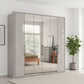Wiemann Saka 225cm Bi-Fold Wardrobe With 2 Glass Doors & 4 Mirror Doors in Glass Pebble Grey styled in  a modern bedroom
