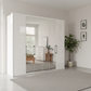 Wiemann Saka 250cm Bi-Fold Wardrobe With 2 Glass Doors & 4 Mirror Doors in White styled in a beautiful room