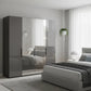 Amelia 200cm 4 Door Bifold Wardrobe with 2 Glass Doors and 2 Mirror Doors - Lava Styled in a Bedroom