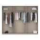 A 3-compartment open wardrobe or closet organizer with beige fabric panels, light wood framing, hanging rods with assorted clothing, a shelf with folded items, and a basket on the bottom right, shown on a white background.