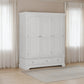 Grey wardrobe with two doors and two drawers in a room with light-colored curtains and wooden floor.