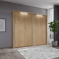 Wieman Brixton Wooden sliding wardrobe doors in a room with a plant and rug.