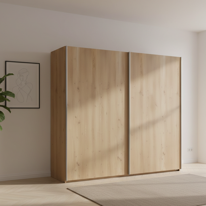Wooden wardrobe in a minimalistic room with a plant and framed picture on the wall.