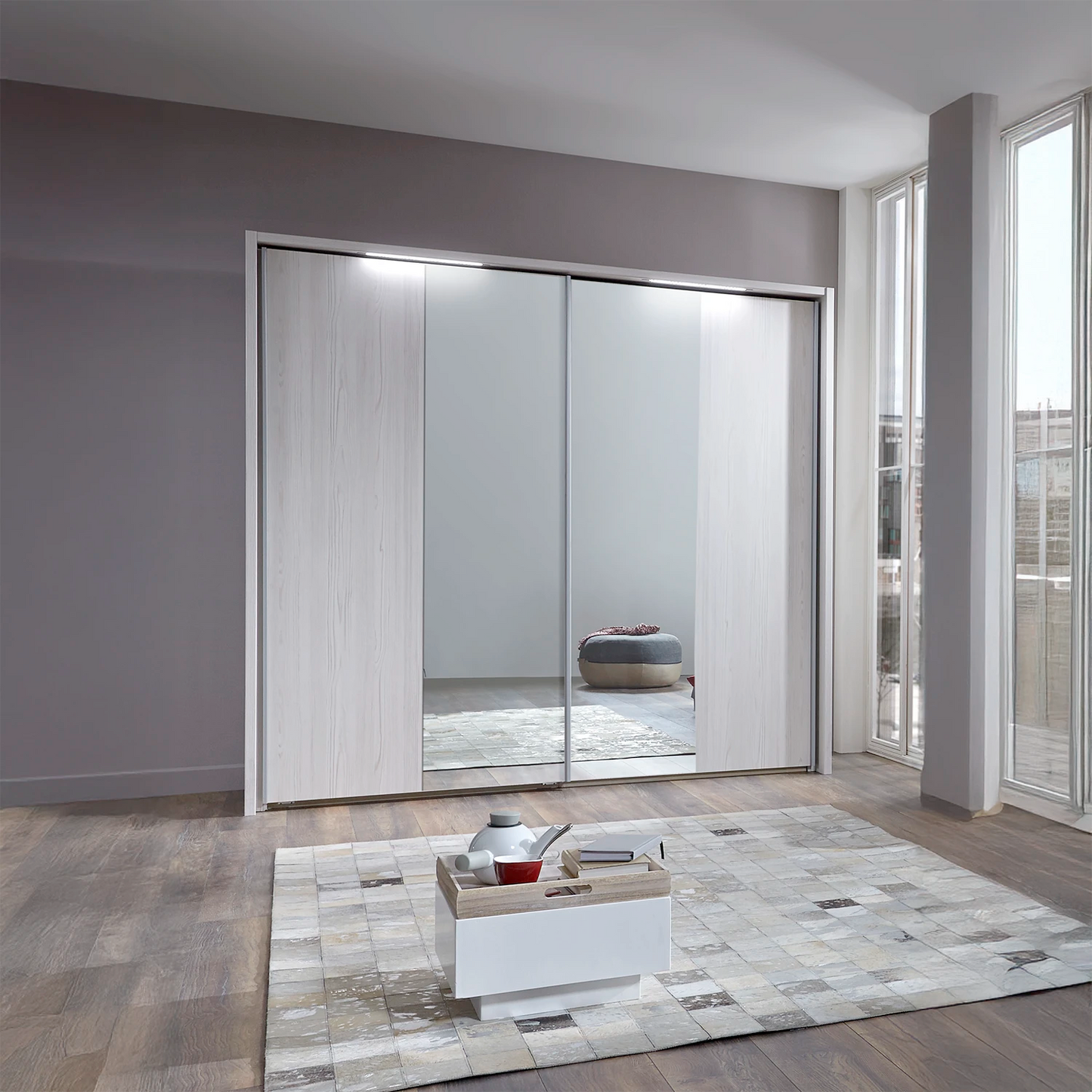 Modern sliding wardrobe by Wiemann with Half Mirror