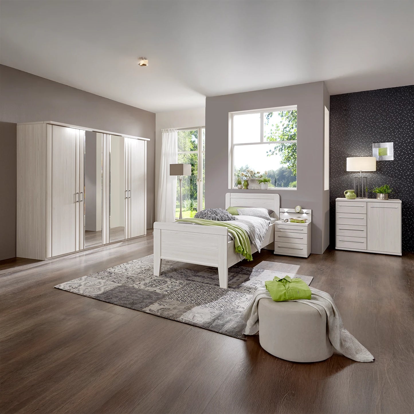 Modern bedroom with white furniture, including a bed, wardrobe, and nightstands.