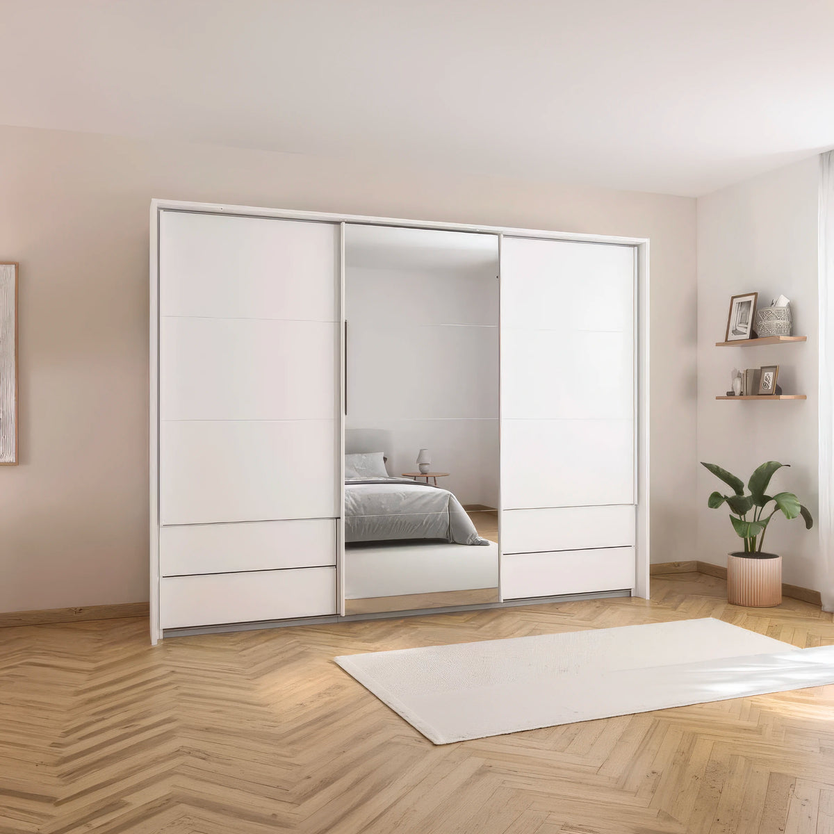 A modern white sliding wardrobe with mirrored doors in a minimalist bedroom setting with light wood herringbone flooring and a white rug.