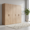 Wooden wardrobe with fiver doors in a room with a plant and framed picture on the wall.
