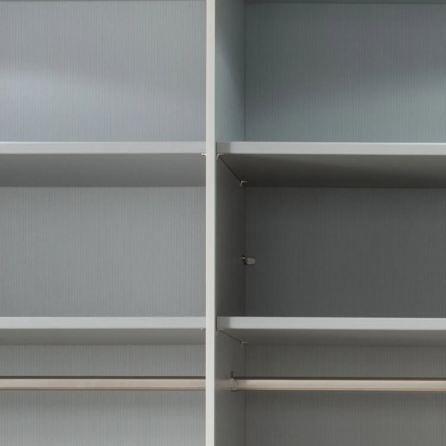Interior view of the Genova Kontrast 3-Door Sliding Wardrobe showing shelving, hanging rail, and organised storage layout