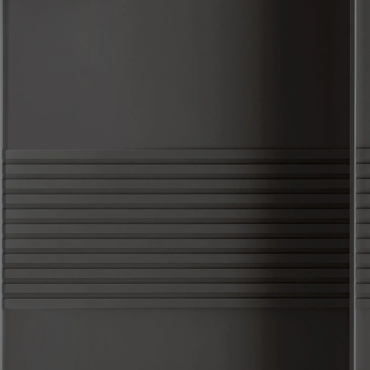 Close-up of a Wiemann Genova Kontrast Large 3-Door Sliding Wardrobe in Graphite Colour with Horizontal Trims on the Doors