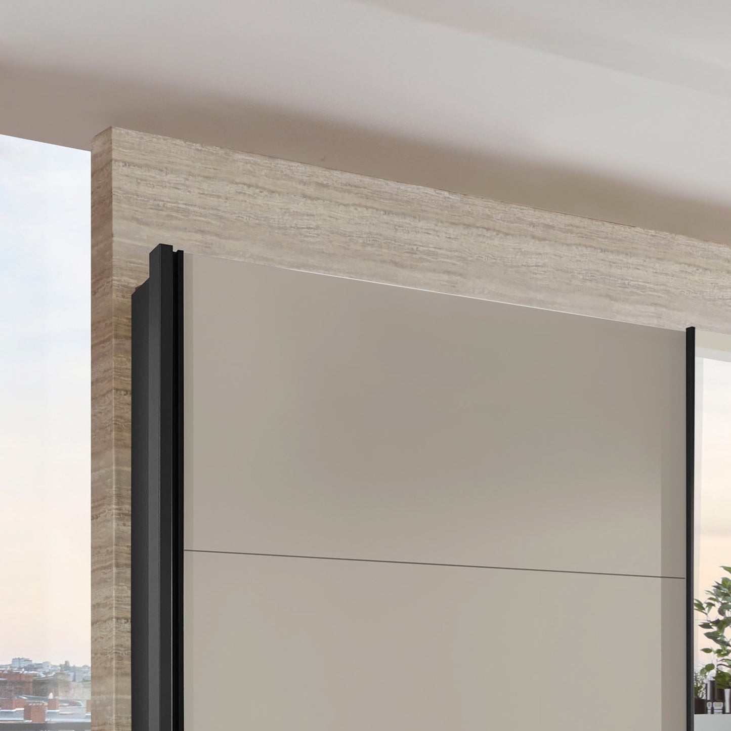 Modern sliding door wardrobe with a black frame and beige wall.