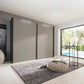 Modern interior with a large Wiemann Halver sliding wardrobe in Pebble Grey and Graphite Colour