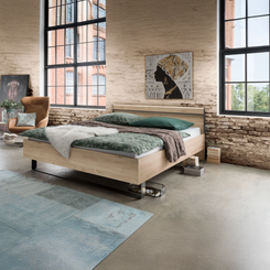 Johnson Futon Bed with Faux Leather Headboard and Slate Angled Feet - Styled in Bedroom