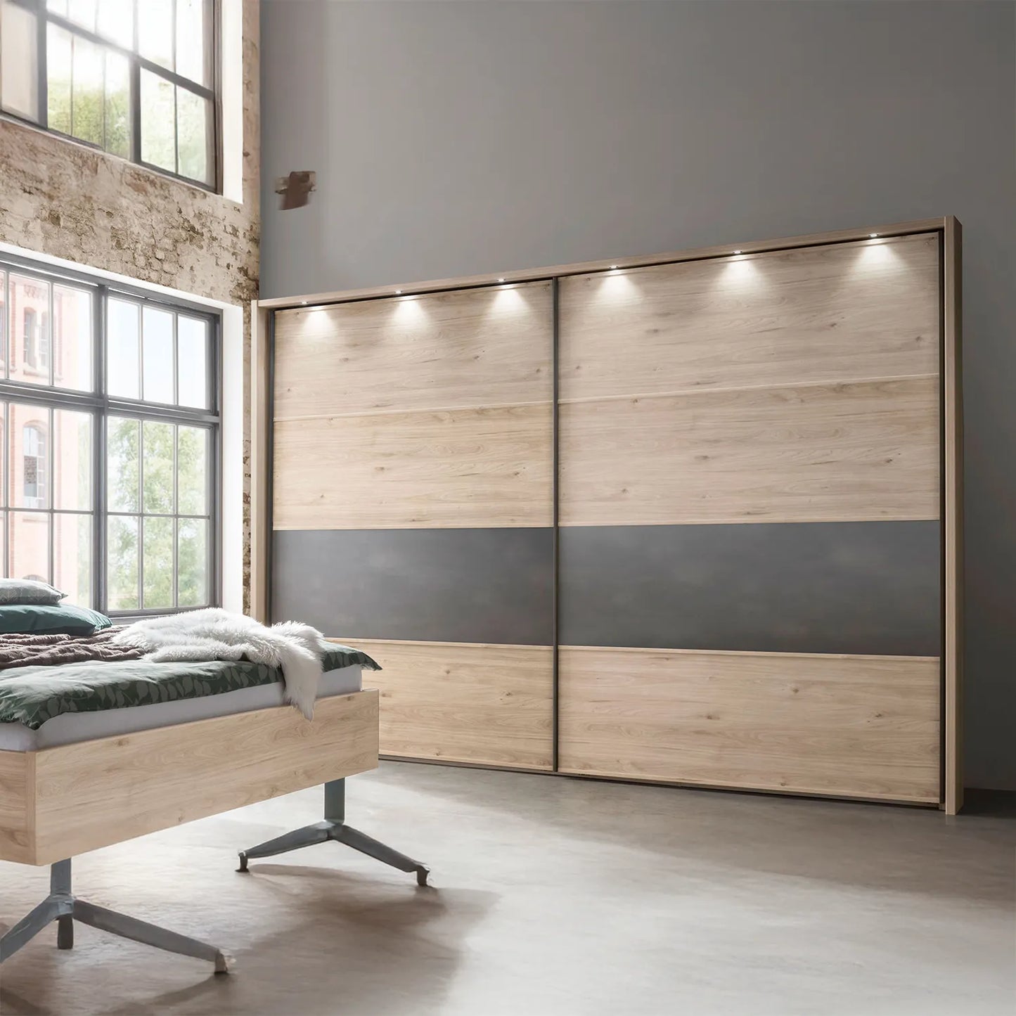 Johnson Holm Oak Sliding Wardrobe with One Slate Finish Panel - Styled in Bedroom With Lights