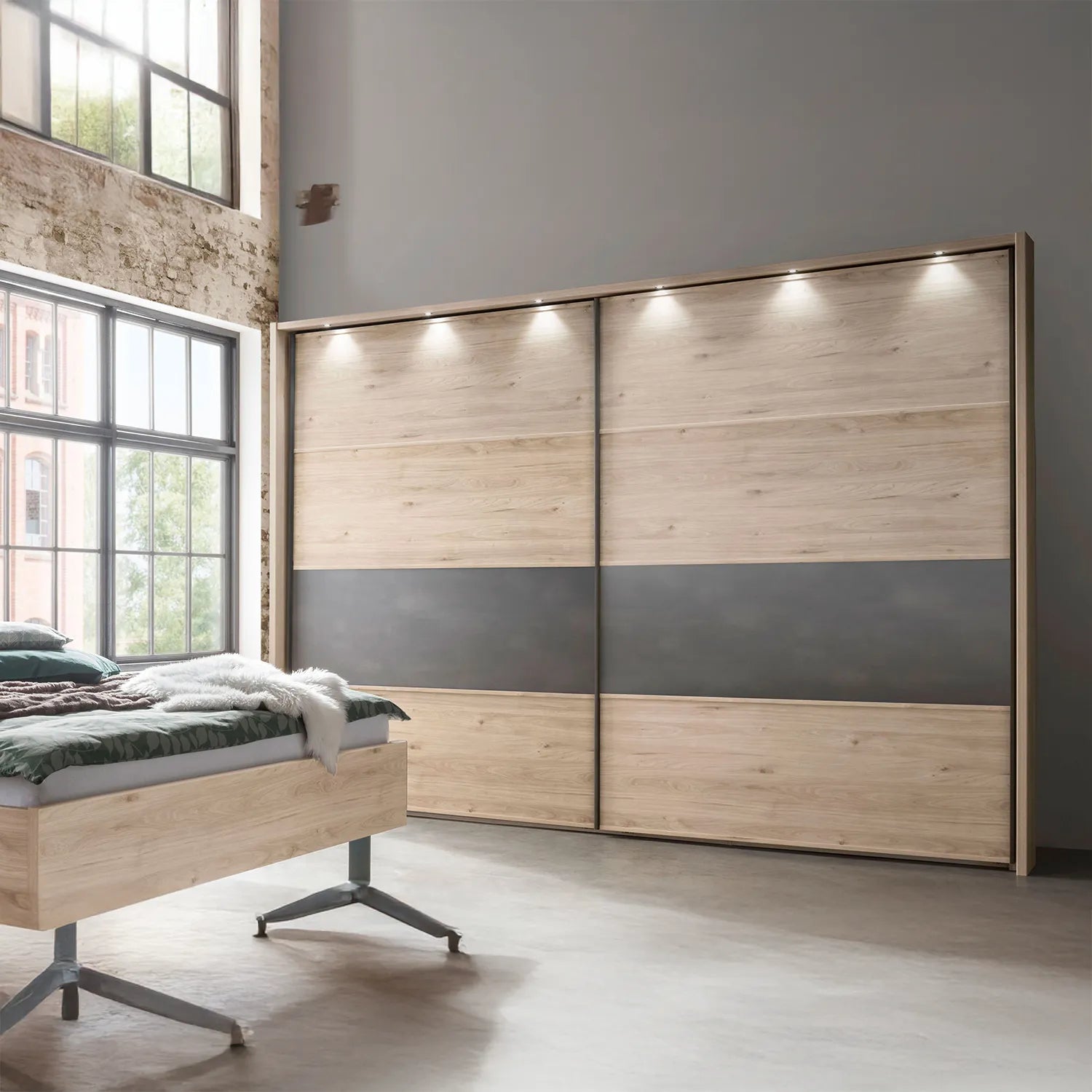 Johnson Holm Oak Sliding Wardrobe with One Slate Finish Panel - Styled in Bedroom With Lights