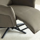 Close up Electric recliner chair in washed olive upholstery