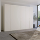 Kacey Pure 6 Door 301cm Wide Wardrobe in White - Styled in a Bedroom