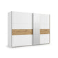 White sliding wardrobe with oak accents and mirror panels. 261cm wide with 3 compartments. Modern design, in stock for quick delivery.