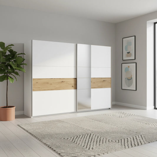 Modern sliding wardrobe with white and wood design in a room with a plant and abstract art.