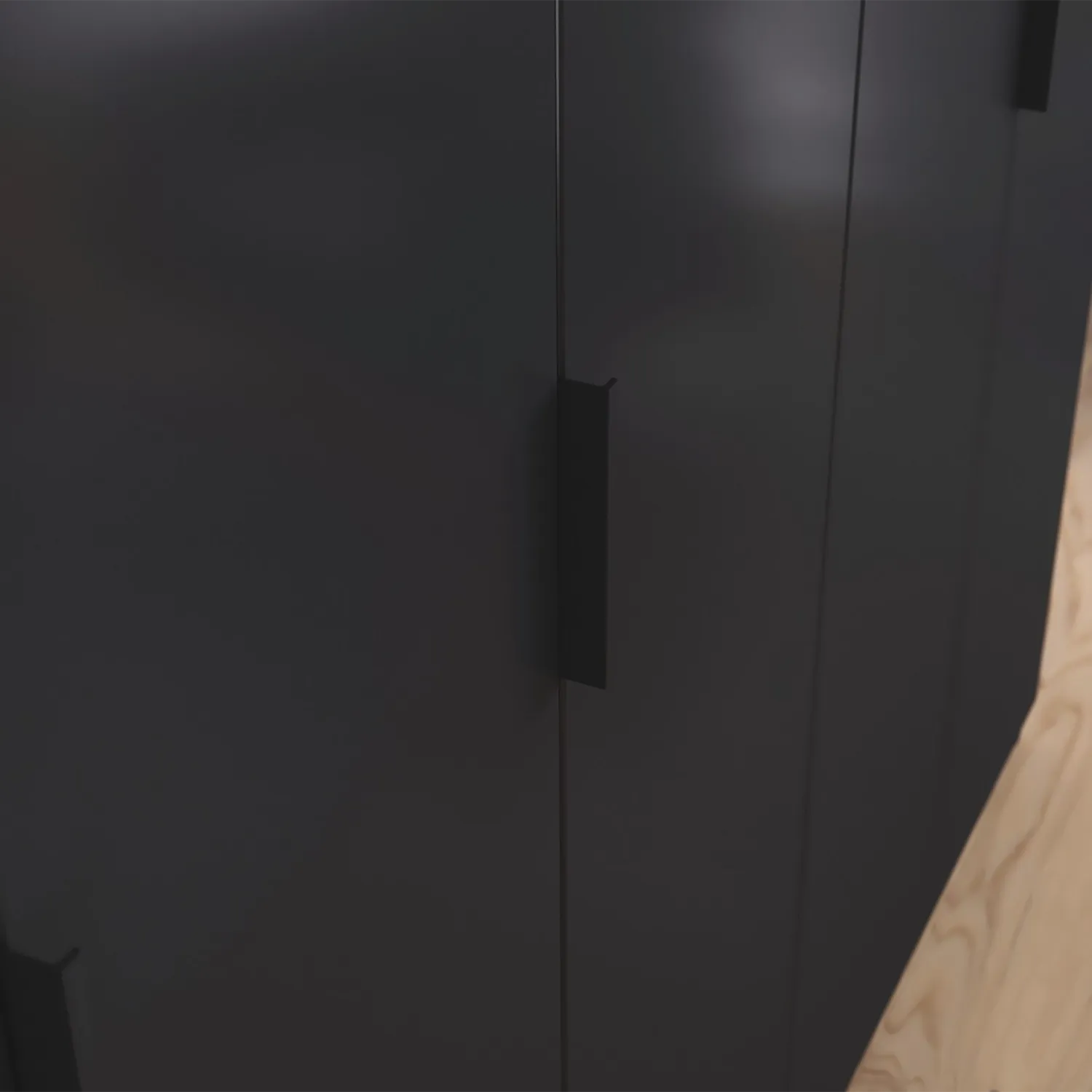 Close-up of a black cabinet with black metal handles