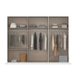 Modern wardrobe with clothes hanging and stacked on shelves against a white background