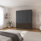 Modern bedroom with a large dark gray wardrobe with bottom drawers