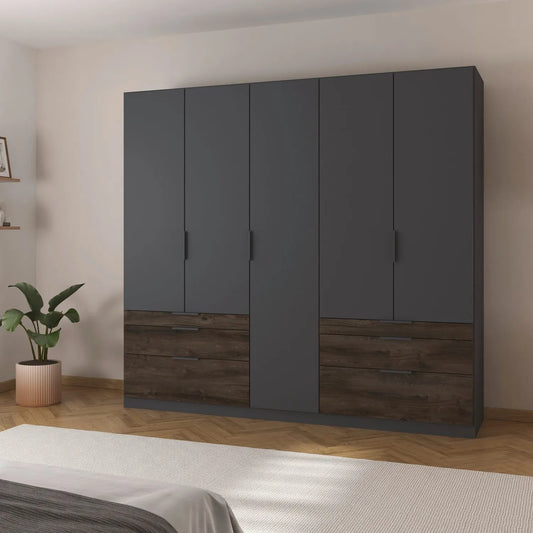 Large dark gray wardrobe with wooden bottom section in a bedroom setting.