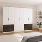 White wardrobe with dark wood accents in a bedroom setting