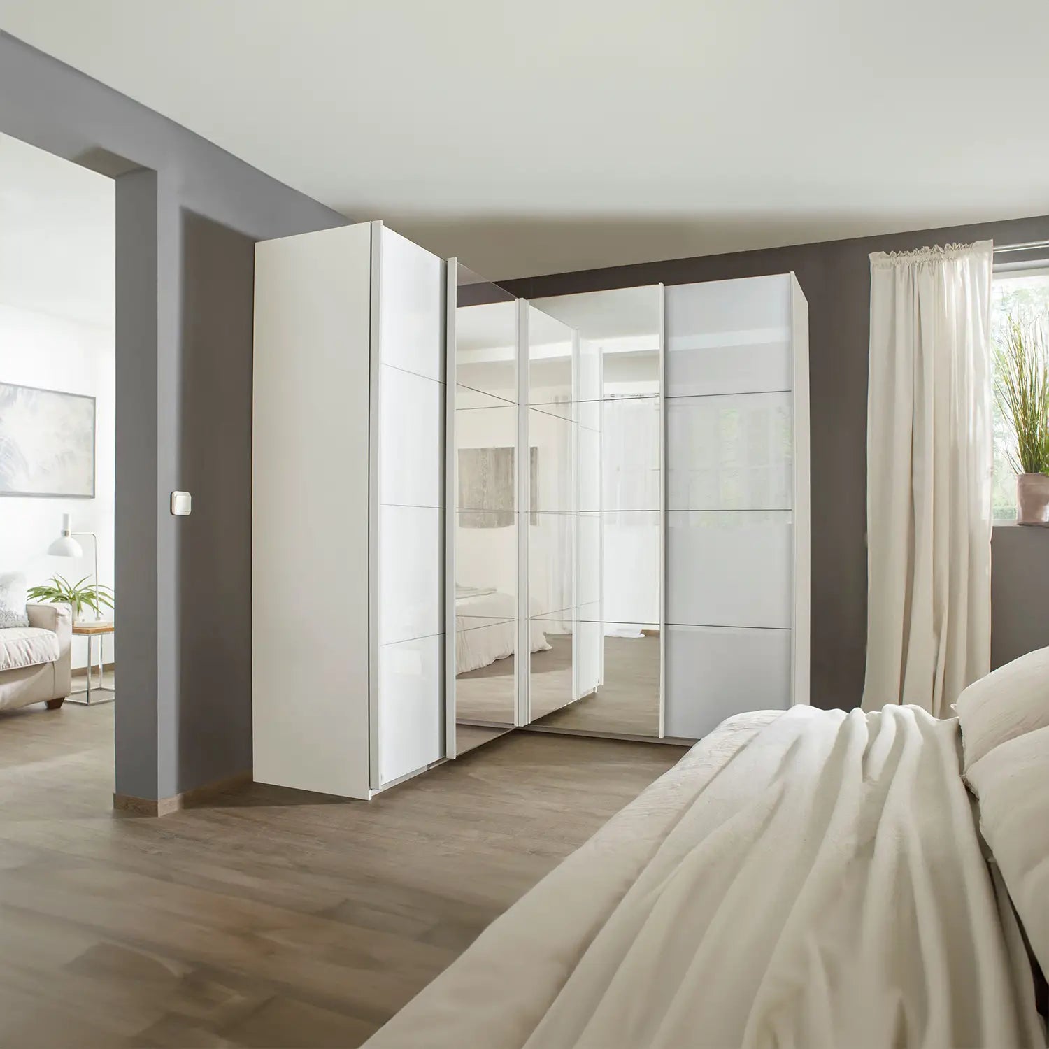 Lema 181cm 4 Door Corner Sliding Wardrobe with 2 Glass Doors and 2 Mirror Doors - Styled in a Bedroom
