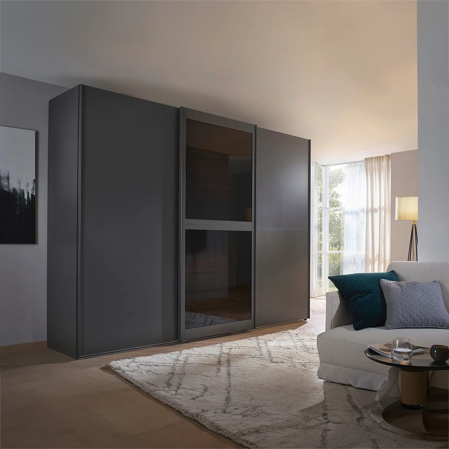 Modern interior with a large grey Lumis wardrobe with 3 sliding doors