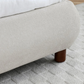 Close Up of Wooden Legs on the Mallow Fabric Upholstered Bed 