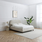 Lifestyle image of Mallow Fabric Upholstered Bed with Walnut Legs. Available in a Double or King 