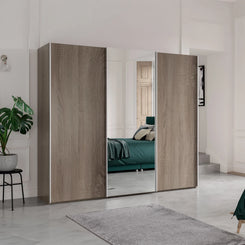 Wiemann Oxford 3 Door Mirror Sliding Wardrobe in Dark Rustic Oak styled in a modern bedroom
