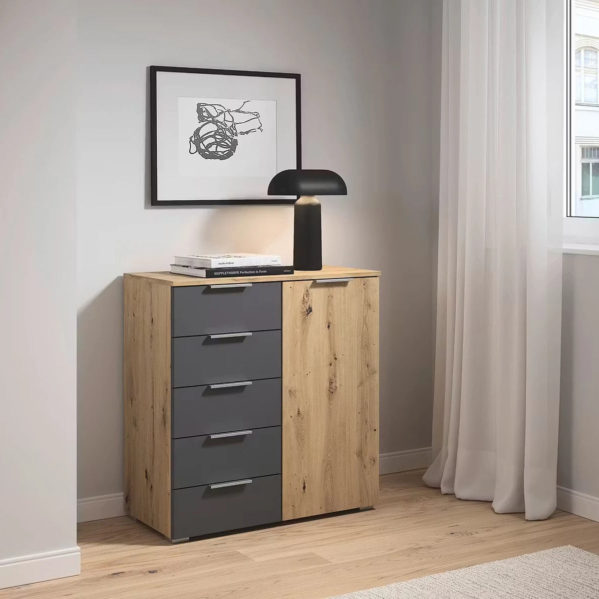 Rauch Monza Chest Of Drawers With 1 Door & 5 Drawers- 80cm in Artisan Oak & Metallic Grey styled in a modern bedroom