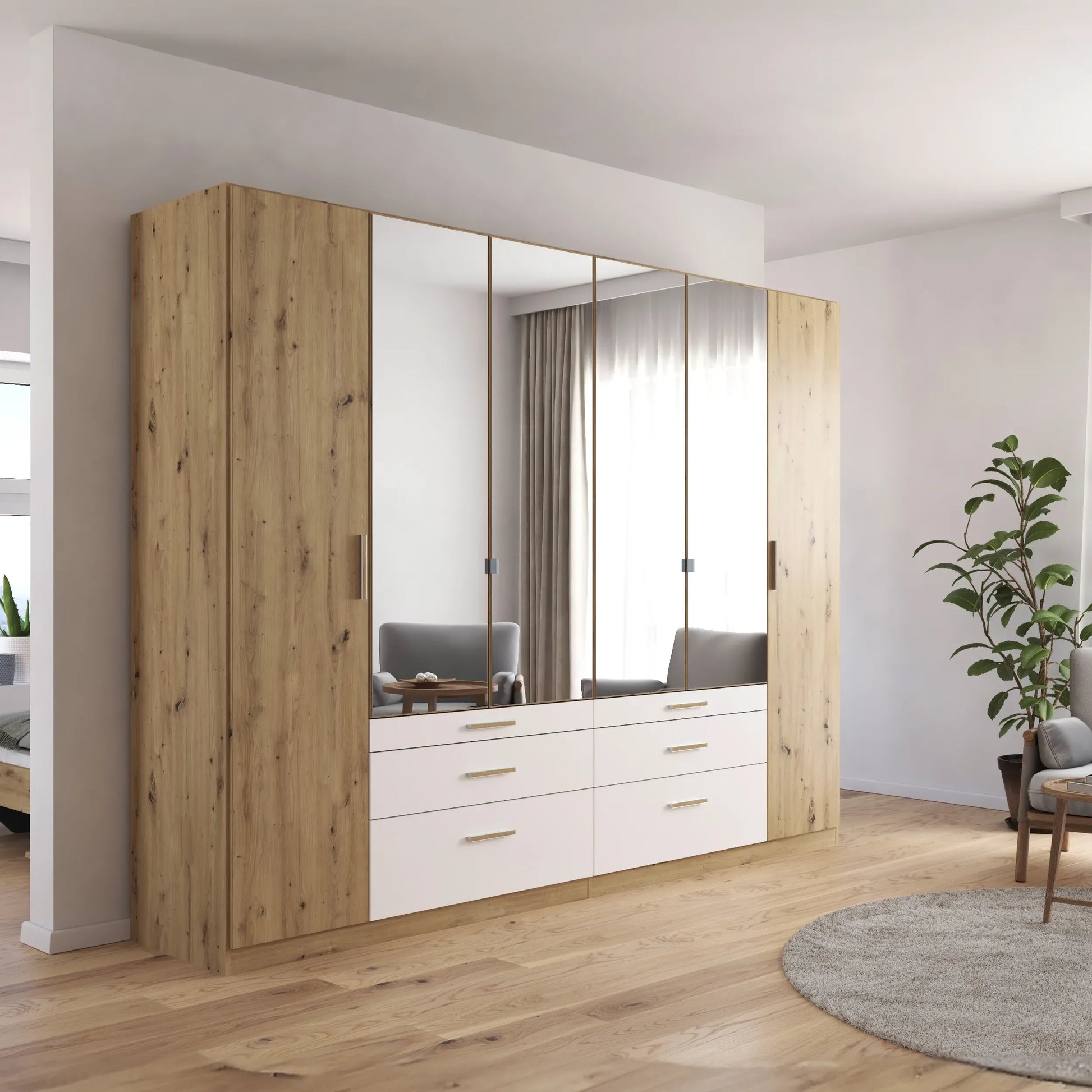 Mosbach 6 Door White & Oak Wardrobe with Mirror and Drawers - 226cm - Side Angle view Styled in a Living Room