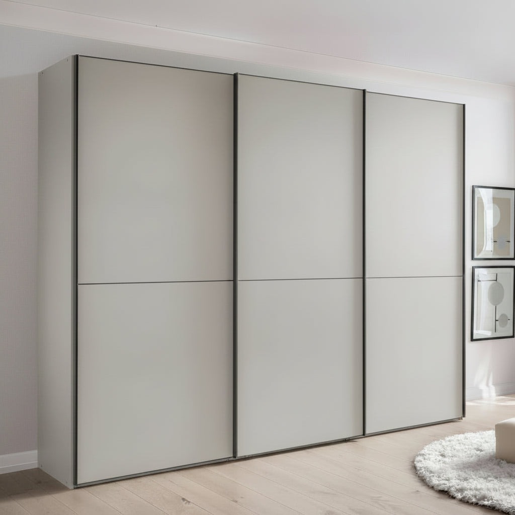 Wiemann Phoenix matt decor Champagne 3 Door Sliding Wardrobe styled in a room 
