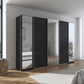 Black wardrobe with mirrors in a modern bedroom setting