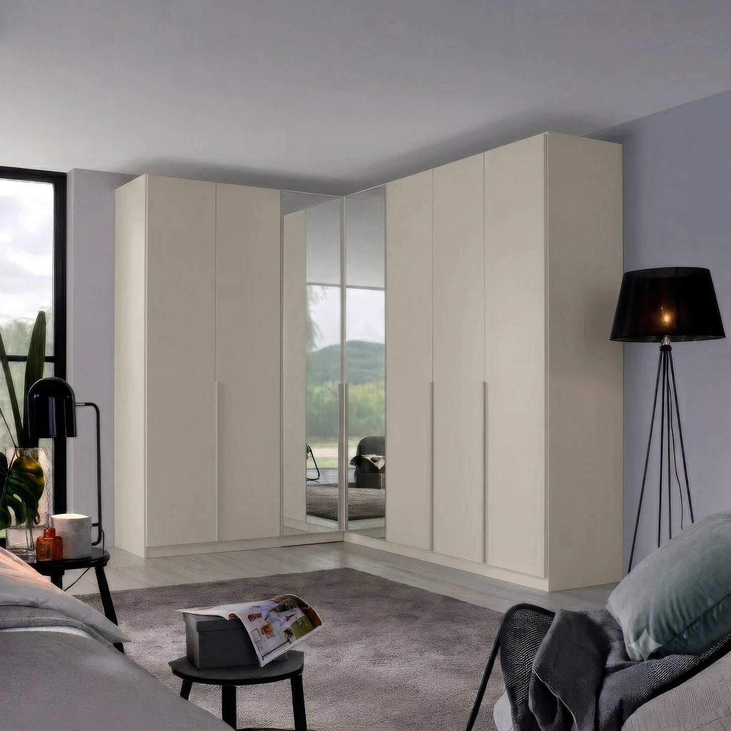 A set of modern corner wardrobe doors in a warm cream finish, featuring two central sliding mirrored doors that reflect the room, set in a contemporary bedroom.