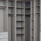 Gray walk-in closet organizer with open shelving, hanging rods, and a white drawer unit on the left side.