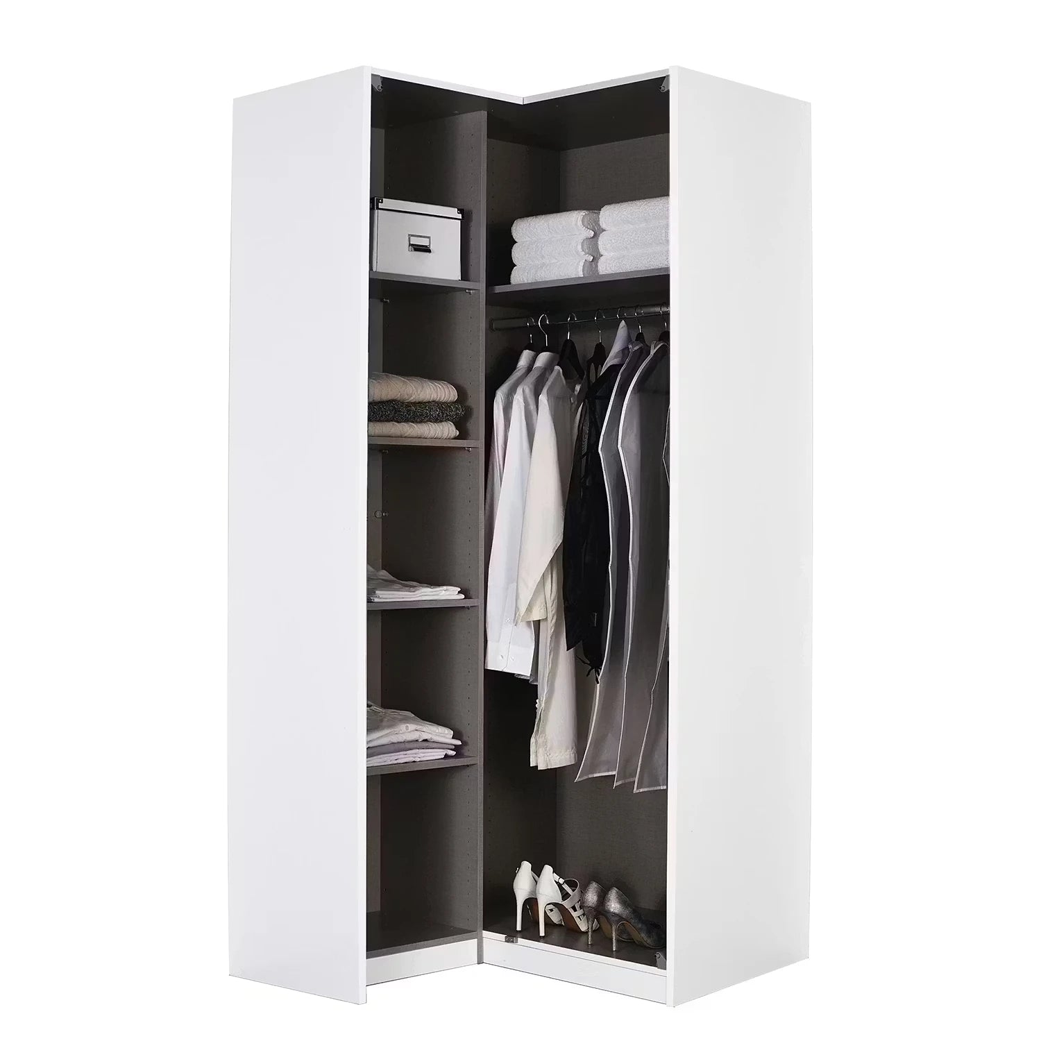 A tall white open wardrobe or closet organizer with dark gray interior shelves and hanging rods, shown on a plain white background. The wardrobe is styled with folded towels, folded garments, and a pair of high heels inside.